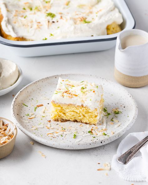 This light and spongy tres leches cake is dripping in a coconut milk syrup and topped with crunchy coconut and boozy rum whipped cream. It's not too soggy or too sweet! #treslechescake #coconuttreslechescake #coconutcake #cake #cincodemayorecipes Rum Tres Leches Cake, Coconut Lime Tres Leches Cake, Lime Tres Leches Cake, Coconut Tres Leches Cake, Coconut Tres Leches, Traditional Mexican Desserts, Leches Cake, Milk Syrup, Tres Leches Cake