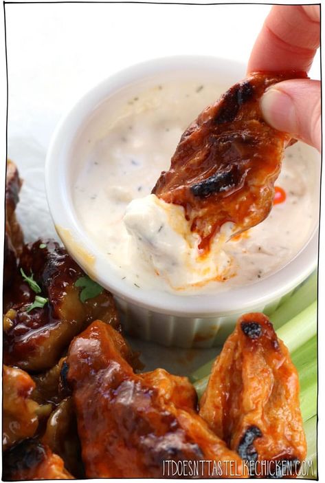 Vegan Chicken Wings!!!! Vegan seitan bites made in two flavours, sticky garlic and buffalo sauce. This classic bar food served with vegan blue cheese dip and all! Make ahead recipe. Perfect for Superbowl Sunday, game night, or a party appetizer. #itdoesnttastelikechicken #veganrecipes #vegan Vegan Chicken Wings, Seitan Wings, Vegan Blue Cheese, Seitan Chicken, Vegan Seitan, Vegan Meat Substitutes, Seitan Recipes, Superbowl Sunday, Vegan Chicken