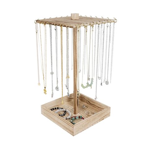 PRICES MAY VARY. Modern & Stylish Design - This wooden necklace display tower is designed to be minimalistic and trendy. Perfect for jewelry store selling, trade-shows, craft shows, shop, etc Metallic Gold Hook - The metallic golden hooks add details to the display, looking pretty attractive wherever it puts. Also allowing a variety of accessories to be displayed Rotating Jewelry Tower - Rotating function for a clear view of all your accessories. A great way to display your jewelry for easy acce Wooden Necklace Holder, Homemade Necklace Holder, Clean Dresser, Stall Decorations, Display Tower, Bracelet Organizer, Necklace Organizer, Wooden Accessories, Jewelry Display Stands