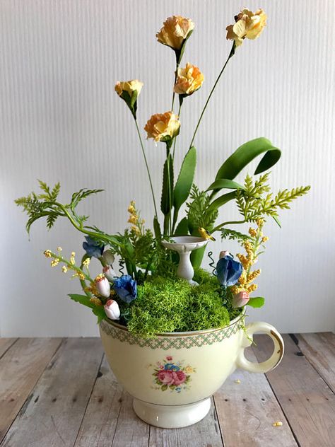 I just finished some gorgeous new tea cup fairy gardens! This vintage tea cup is filled with pretty paper flowers that have been hand tinted, moss, ferns, greenery, handmade clay tulips, and a tiny birdbath. The tea cup features a floral bouquet design and a trellis pattern with Teacup Fairy Garden, Tiny Fairy Garden, Tea Cup Garden, Hedgehog Crafts, Fae Garden, Garden Homes, Tiny Gardens, Diy Succulent Terrarium, Fairies Garden