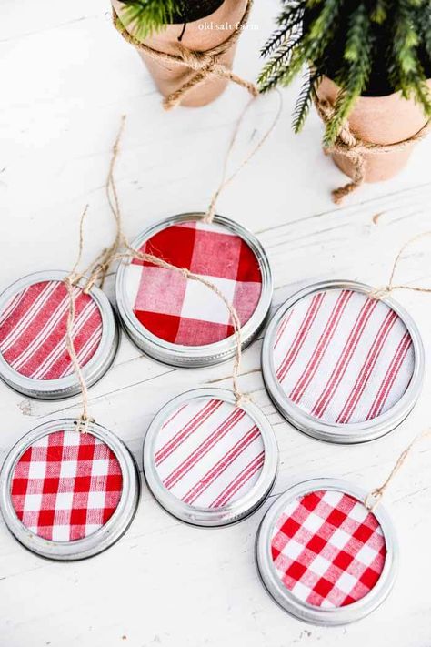 Make these darling mason jar lid ornaments in less than five minutes! Perfect for adorning your tree, or giving as gifts. An easy DIY Christmas ornaments tutorial using your favorite fabric. Christmas Mason Jar Lids Ideas, Canning Jar Lid Ornaments, Mason Jar Lid Christmas Crafts, Christmas Ornaments Made From Canning Jar Lids, Canning Lids Ornaments, Canning Ring Ornaments, Canning Jar Lids Christmas Ornaments, Mason Jar Lid Ornaments Diy, Canning Jar Lid Crafts