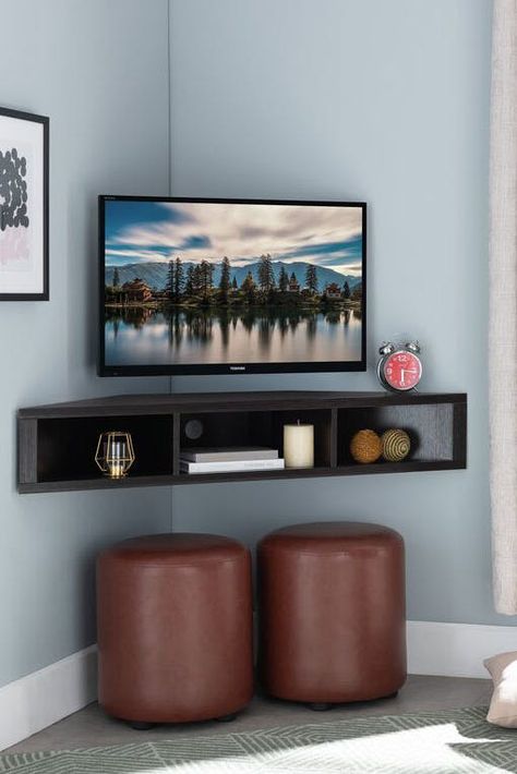 20 Floating Shelves Ideas, So You Can Create Extra Storage Space That Isn’t an Eyesore #purewow #organizing #home #decor #home picks Floating Corner Tv Stand, Corner Tv Ideas, Corner Tv Console, Wall Mounted Media Console, Corner Tv Stands, Ruang Tv, Furnitur Ruang Keluarga, Corner Tv Unit, Small Condo