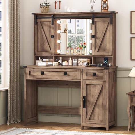 PRICES MAY VARY. [Farmhouse Style] This vanity desk stands out because of its rich farmhouse style. With a perfect blend of distressed white finishes, z-brace barn door trim, and exposed metal hardware, the makeup vanity desk is not only robust and sturdy, but it also has farmhouse charm and adds a relaxed, earthy aesthetic to the room. The unique sliding door design on the upper part can be used to hide the shelves/lighted mirror, both exquisite and practical [Powerful Storage Space] Overall si Wooden Vanity Desk, Western Vanity, Rich Farmhouse, Rustic Makeup Vanity, Vanity Table With Drawers, Desk Stands, Vanity Desk With Mirror, Desk With Mirror, Farmhouse Vanity