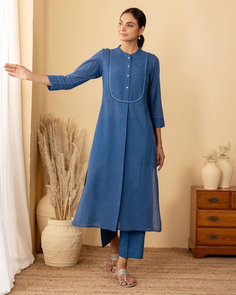 ~BASICS~ Everyday Essentials - New Arrivals! A striking royal blue kurta with an elongated yoke, this silhouette is tailored to flatter. The textured weave enhances the blue and the subtle thread work adds a touch of elegance to a classic silhouette. [ Cottons Jaipur, Cotton, Basics, Everyday, Essentials, New Arrivlas] #cottons #cottonsjaipur #newarrivals #basics #everday #essentials #dailyfits #confort #cottonkurtas #breathablefabric #handcrated #solidkurtas #solid #monochrome #cottonsu... Traditional Kurta Designs Women, Handloom Kurti Designs, Yoke Designs, Cotton Kurti Stitching Ideas, Blue Kurti, Thread Work Designs, Cotton Kurta, Yoke Designs For Kurtis, Kurti Pattern