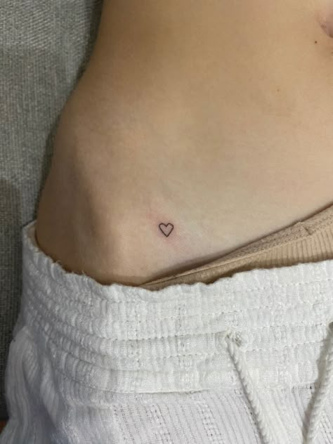 Tiny heart tattoo on hip Heart On Hip Tattoo Simple, Tattoo Ideas Female Cool, Hip Stick N Poke, Small Significant Other Tattoos, Mini Stick N Poke, Small Hip Bone Tattoos Women, Pelvic Tattoo Hip Small Heart, Subtle Heart Tattoo, Stick And Poke On Hip