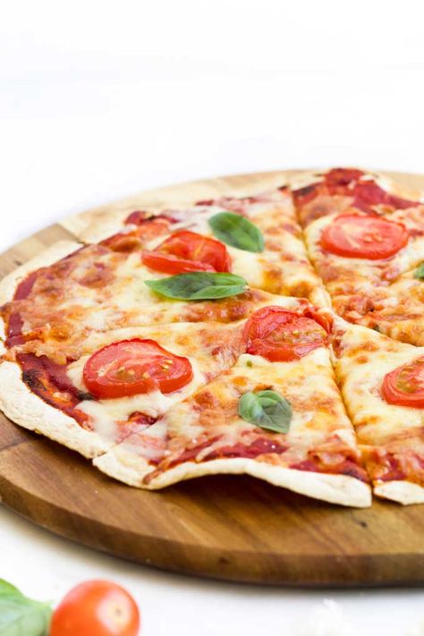 Looking for a quick, easy and tasty lunch option? Tortilla Pizzas is something the whole family will love. Top a tortilla wrap with pizza sauce, cheese and your favourite pizza topping. Bake in the oven until the cheese is golden and bubbly and the base is crispy. A fun lunch to make with kids - set up a toppings bar (tons of suggestions given in post) and let them get creative.. #tortillapizza #homemadepizza #lunchidea #kidsfood #kidslunch #kidsinthekitchen Tortilla Pizzas, Pizza Wrap, Pizza Tortilla, Toppings Bar, Pizza Wraps, Meat Lovers Pizza, Low Carb Soup Recipes, Healthy Pizza Recipes, Healthy Low Carb Dinners