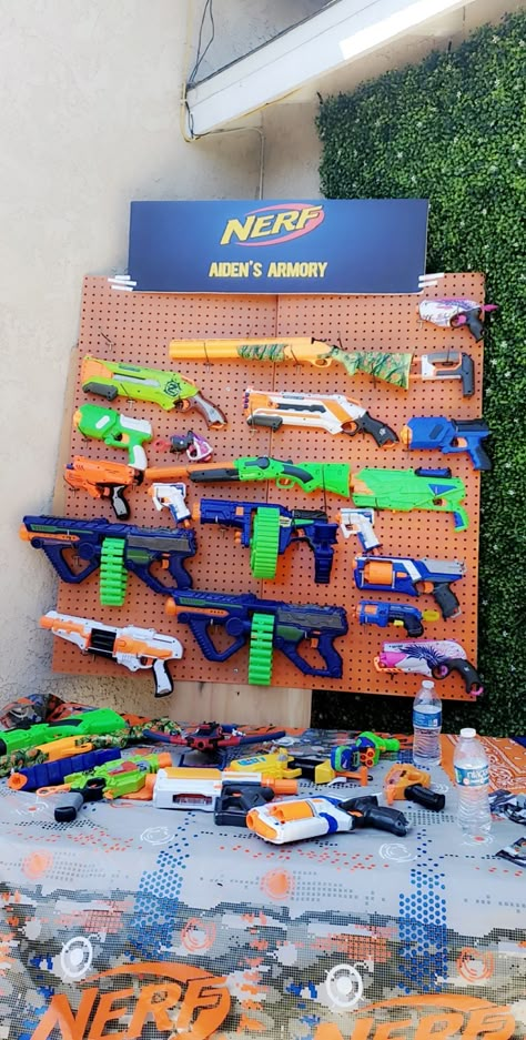 Gel Blaster Party, Indoor Nerf Battlefield, Nerf Wars Birthday Party, 7th Birthday Ideas For Boys, Nerf Party Backdrop, Boys Nerf Birthday Party, Boys 7th Birthday Party Ideas Themes, Nerf Wars Battlefield Diy, Nerf Battle Birthday Party