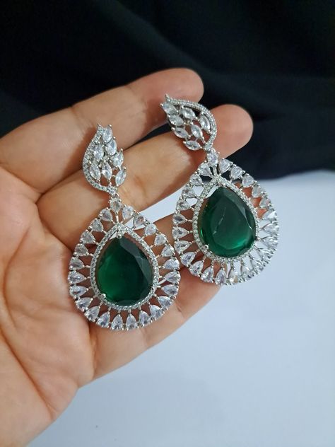 Contact at 8167335829. World wide shipping at low delivery cost. Video calling possible at request. Buy choker, necklaces, long earrings, big stone earrings, tops, bangles, finger rings and more. Necklaces Long, Earrings Big, Cz Jewelry, Earrings Green, Finger Rings, Cz Earrings, American Diamond, Choker Necklaces, Stone Earrings