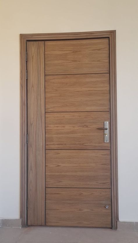 Elegant, sturdy door that adds charm and withstands daily use Flush Door Design, House Window Design, Flush Door, Modern Tv Wall Units, Pivot Door, Wooden Front Door Design, Wooden Main Door, Modern Tv Wall, Wooden Main Door Design