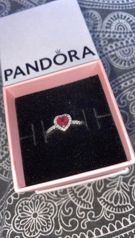 Tell the world you believe in love with our Elevated Red Heart Ring. A heart-shaped red man-made crystal sits at the centre of the ring accented by sparkling pavé in the frame of the setting and along the front of the band. Pair it with other Pandora Timeless pieces, like our Red Heart Stud Earrings, for an elegant look. on some of the sizes shipping will be fast. doesn't include the Pandora box Pandora Rings Stacked Ideas, Pandora Red Heart Ring, Luxury Red Heart Ring, Pandora Sparkling Red Heart Ring, Pandora Pink Heart Ring, Heart Ring Pandora, Pandora Elevated Heart Ring, Pandora Two Sparkling Hearts Ring, Elevated Heart Ring