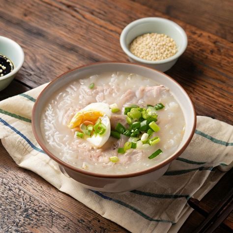 Congee, a comforting and nourishing rice porridge recipe, is a staple in Chinese cuisine, often enjoyed for breakfast or as a light meal during illness. Its soothing texture and versatile nature allow for numerous variations, making it a beloved dish across China. This simple version serves as a perfect base for various toppings, adapting to any taste. Preparation Time: 5 minutes Cooking Time: 1 hour 30 minutes Resting Time: 5 minutes Total Time: 1 hour 40 minutes Serving: 4 Ingredients: ... Congee Breakfast, Congee With Leftover Rice, Breakfast Congee, Rice Congee Breakfast, Congee Recipe Breakfast, Pork And Century Egg Congee, Rice Porridge Recipe, Rice Porridge, Porridge Recipes