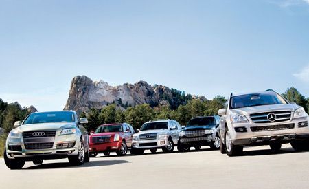 From the Archive: Can America's pickup-based SUVs measure up? We compare the Audi Q7, Cadillac Escalade, Infiniti QX56, Lincoln Navigator, and Mercedes GL450. Mercedes Gl450, Suv Comparison, 4x4 Wheels, Infiniti Qx56, Chauffeur Service, Lincoln Navigator, Audi Q7, Luxury Suv, Car And Driver