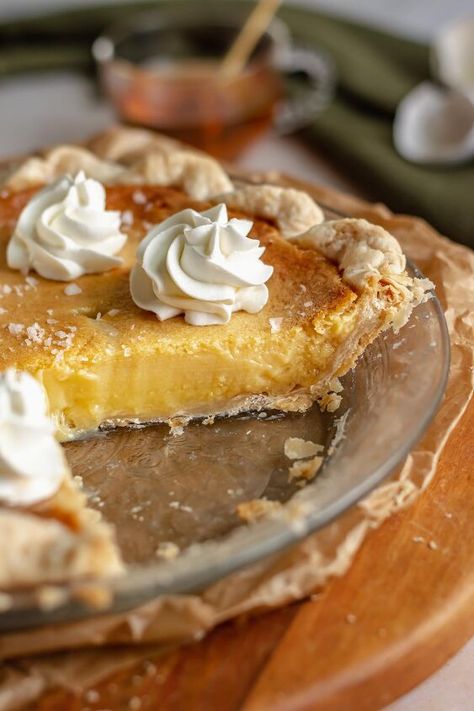 This easy salted honey chess pie has a creamy custard texture full of floral honey flavor. It's baked in a flaky all-butter pie crust (or frozen pie crust) and topped with a drizzle of honey, flaky salt, and fresh whipped cream. This version of chess pie has probably become my new favorite. It's got all of the qualities of a chess pie - creamy custard, flaky pie crust, perfectly sweet. But it tastes SO much better.The addition of honey provides such a nice floral, naturally sweet fla… Southern Buttermilk Pie, Buttermilk Pie Recipe, Milk Pie, Frozen Pie Crust, Buttermilk Pie, Chess Pie, American Desserts, Frozen Pie, Butter Milk