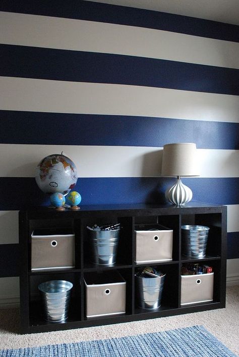 The use of bold blue and white stripes in my boys' bedroom creates a lot of personality without breaking the bank. The room is fun, vibrant, and full of energy just like its inhabitants. The bookcase is from IKEA and the cardboard deer head is from Cardboard Safari. Striped Accent Wall, Townhouse Decorating, Diy Accent Wall, Striped Walls, Paint Stripes, Nautical Nursery, Big Boy Room, Blue Painting, Boys Bedroom