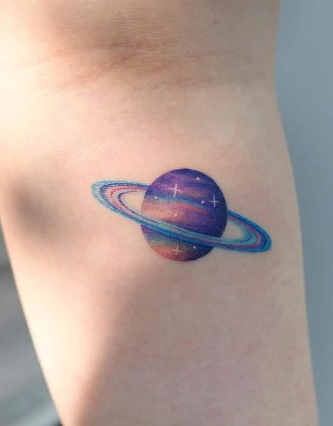 Purple Tattoo On Dark Skin, Purple Ink Tattoo, Dark Blue Tattoo, Small Colorful Tattoos, Boho Tattoo, Planet Tattoo, Saturn Tattoo, Purple Tattoos, Piercings Ideas