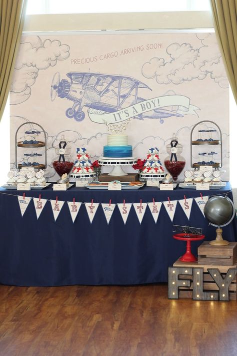 Celebrate the Impending Arrival of Precious Cargo With This Vintage Aviation Baby Shower Airplane Themed Birthday Party, Airplane Baby Shower Theme, Vintage Airplane Baby Shower, Indian Baby Shower Decorations, Baby Shower Chair, Boy Shower Themes, Indian Baby Showers, Travel Baby Showers, Airplane Baby Shower