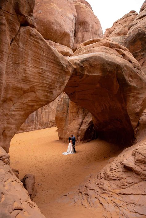 Arches-National-Park-Moab-Elopement-bride-and-groom-pose-together-for-portraits-at-sand-dune-arch Arches National Park Wedding, Arches National Park Elopement, Red Earth Venue Moab, Moab Utah Wedding, Desert Wedding Photography, Wonderland Wedding Dress, Green Fall Wedding, Rancho Wedding, Winter Wonderland Wedding Dress