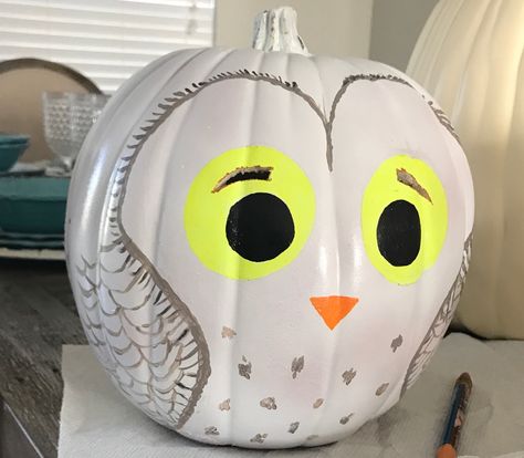 Hedwig pumpkin with glow in dark eyes and a couple places for light to come through as well Hedwig Pumpkin Painting, Owl Painted Pumpkin, Harry Potter Painted Pumpkin, Owl Pumpkin Painting, Hedwig Pumpkin, Harry Potter Pumpkin Painting, Literary Pumpkins, Owl Pumpkin Carving, Cute Painted Pumpkin Ideas