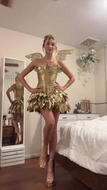 TikTok · Tessa Angel Halloween Costumes, Thrift Store Fashion, Beautiful Feathers, Fairy Halloween Costumes, Book Day Costumes, Golden Dress, Trendy Halloween Costumes, Iconic Dresses, Trendy Halloween