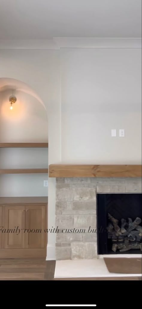 English Cottage Stone Fireplace, Fireplace On Short Wall Of Vaulted Ceiling, Fireplace One Side Built In, Built In Arched Bookshelves Around Fireplace, Short Fireplace Mantle, Fireplace Ideas Simple, Gas Fireplace No Hearth, Stone Fireplace Halfway Up Wall, Stone Fireplace And Built Ins