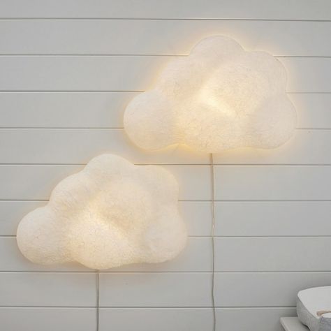 Set their room aglow with this gently illuminated cloud. Crafted of hand-finished paper-mache, it boasts billows of texture and dimension for a dreamy accent in your child's room. Cloud Lighting Design, Boho Cloud Nursery, Nursery Wall Lamp, Cloud Themed Nursery, Cloud Theme Nursery, Cloud Pottery, Kids Bedroom Lighting, Cloud Nursery Theme, Cloud Wall Light