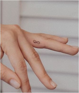 Infinity Eye Catching Finger Tattoo Infinity Symbol Finger Tattoo, Finger Love Tattoo, Tiny Tattoos Infinity, Infinity Tattoo On Ring Finger, Hand Tattoos Infinity, Infinity Minimalist Tattoo, With You Tattoo, Mini Infinity Tattoo, Infinity Hand Tattoo