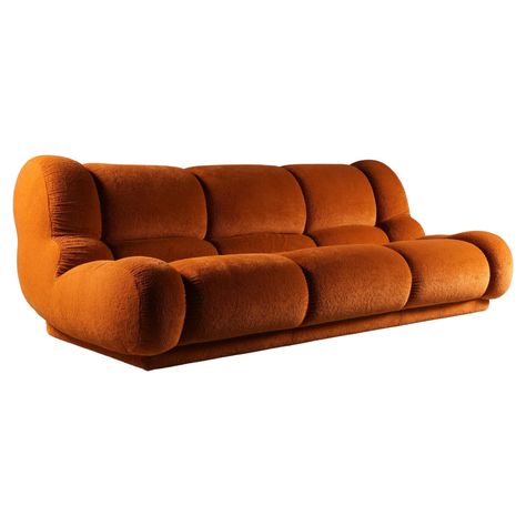 Amazing sofa in exceptionally well-preserved orange/rusty brown velvet upholstery. The standout feature is the thick, plush velvet, showcasing the high-quality craftsmanship for which Italian manufacturers are renowned. The superior velvet material used enhances the sofa's luxurious appeal, reminiscent of Mario Bellini's Camaleonda but without the exorbitant price. This striking sofa features large, soft curves and inviting shapes, making it a visual delight. The elegant curves extend to the bac B&b Italy, Mario Bellini Sofa, Bellini Sofa, 70s Design, Mario Bellini, Italian Mid Century Modern, Three Seat Sofa, Sofa Material, Large Chair