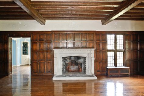 Room with wood paneling, ceiling beams & Tudor arch fireplace Tudor Ceiling, 4 Season Room, Old Manor, Basement Family Room, Tudor Style Homes, Gathering Room, Tudor House, Tudor Style, Wood Molding