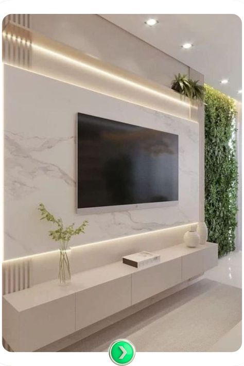 Light marble TV wall with vibrant greenery, pairing natural elements with sleek textures for a lively and modern focal point in any living area. Tv Wall Marble, Wall Marble Design, Urban Living Room Decor, Marble Tv Wall, Luxury Tv Wall, Urban Living Room, Tv Room Design, Decoration Tips, Tv Wall Design