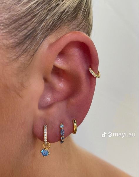 Gold blue jewelry earings ear piercing Earring Stack Ideas, Earring Stacks, Piercings Ear, Ear Piercings Chart, Earring Inspo, Earring Stack, Piercing Inspo, Pretty Ear Piercings, Cute Ear Piercings