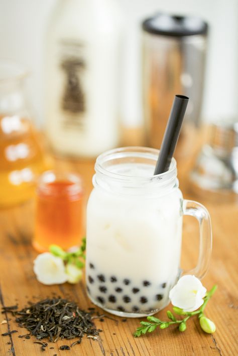 So, are you a boba tea lover? While insisting that they love tea, I have a few friends who can't stand boba milk tea. Is it the squishy, chewy texture of those tapioca balls that turn them off? Maybe poor quality tea? Perhaps a bad proportion of tea to milk? Whatever the reason, I'm hoping that this recipe for Jasmine Tea with Honey Boba might turn things around. This recipe comes straight from The Boba Guys themselves. If you don't already know of them, they're a company base... Easy Bubble Tea Recipe, Jasmine Milk Tea, Honey Boba, Iced Tea Recipes Homemade, Tea With Honey, Asian Bakery, Bubble Tee, Homemade Iced Tea, Bubble Tea Recipe