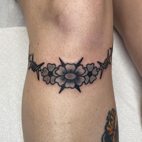 Flowers and barbed wire knee wreath 💣 always down to do knee tattoos! DM or email to book! Wire Knee Tattoo, Knee Wreath Tattoo, Barbed Wire Knee Tattoo, Traditional Barbed Wire Tattoo, Barbed Wire Tattoo, Wire Tattoo, Knee Tattoos, Barbed Wire Tattoos, Wreath Tattoo