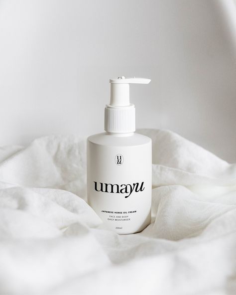 A white matte pump bottle with Umayu branding sitting on a white linen cloth. Japanese Logo, Japanese Skincare, Oil Moisturizer, Brand Identity Design, Brand Packaging, Original Image, Identity Design, Japanese Traditional, Face And Body