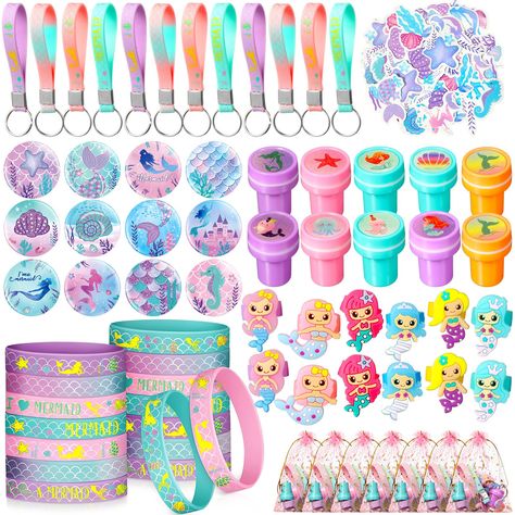 PRICES MAY VARY. Mermaid Party Gift Set: you will receive 12 pieces mermaid keychains, 12 pieces mermaid bracelets, 12 pieces mermaid stampers, 12 pieces mermaid pin badges, 12 pieces mermaid rings, 12 pieces organza bags, 50 pieces mermaid stickers, abundant in quantity, meeting your different decorative needs, enough to share with your friends Mermaid Theme Design: these mermaid birthday party favors contain rich mermaid theme elements, cute and vivid, prefect for mermaid birthday party suppli Mermaid Birthday Party Goodie Bags, Mermaid Birthday Party Table Decorations, Mermaid 6th Birthday Party, H2o Just Add Water Birthday Party, Mermaid Birthday Party Favors, Disco Mermaid, Mermaid Theme Goodie Bags, Mermaid Giveaways Party Ideas, Mermaid Birthday Party Loot Bags