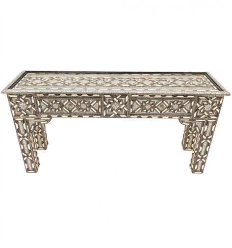 Our two-drawer, glass-topped Zia console table is a piece that seems to burst with a sense of life and movement. Its bone-encrusted maillechort surface is decorated with an exuberant blend of intersecting floral and geometric patterns, accentuated by a boldly contrasting colour scheme of black, white and silver. Height: 80cm Width: 160cm Depth: 45cm Moroccan Bazaar, Sense Of Life, Colour Scheme, Geometric Patterns, Console Table, Contrasting Colors, Entryway Tables, Color Schemes, Geometric Pattern