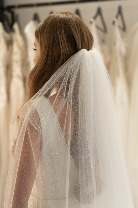 Wide glitter veil. Make a grand entrance with this wide glitter wedding veil, designed to drape beautifully for a dramatic, ethereal effect. The soft tulle cascades gracefully, shimmering with delicate glitter that catches the light with every movement. A perfect balance of glamour and romance, this veil creates a breathtaking silhouette, ensuring you shine with elegance on your special day. Details: • Designed with a metal comb;• Color according to your preferences - pure white or light ivory;• Glitter Wedding Veil, Glitter Veil, Veil Short, Catholic Veil, Wedding Glitter, Wedding Veils Short, Wedding Hairstyles And Makeup, Cathedral Bridal Veils, Short Veil