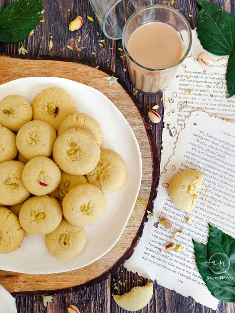 Nan khatai is an authentic Indian sweet and savory eggless cookie that can be easily prepared at home. In its authentic recipe, ghee, maida, rava (sooji), gram flour (besan) and sugar are used . Mostly made in Diwali ❤️ #nankhatai #sweets #shortbread #nankhataiphotography Nankhatai Food Photography, Nan Khatai Photography, Diwali Sweets Photography, Nan Khatai, Sweets Photography, Eggless Cookie, Eggless Cookies, Diwali Sweets, Dessert Photography