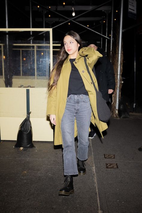 Olivia Rodrigo Keeps it Casual in Trench Coat, Jeans & Dr. Martens – Footwear News Doc Martens Boots Outfit, Dr Martens Combat Boots, Yellow Trench Coat, Young Adult Fashion, White Doc Martens, Doc Martens Outfit, Black Dr Martens, 90s Inspired Outfits, Gray Jeans