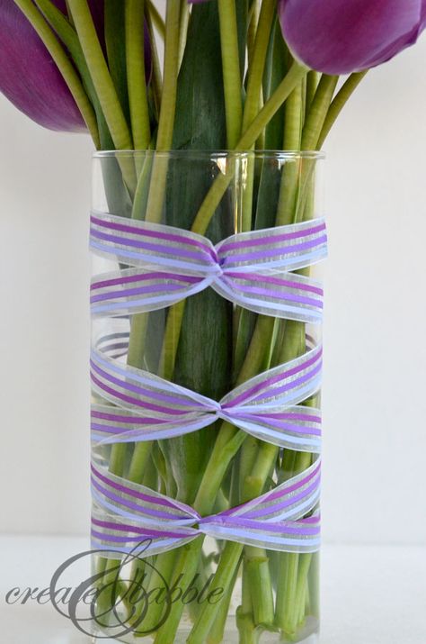 ribbon wrapped vase_createandbabble.com Ribbon Around Vase, Wrapping Bottles, Cylinder Vase Centerpiece, Ribbon Basket, Bud Vases Arrangements, Vase Ideas, A Vase Of Flowers, Ribbon Ideas, Event Decor Direct