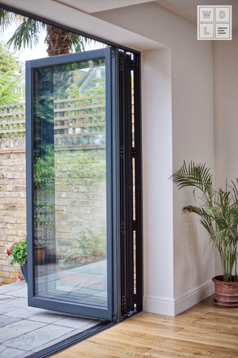 Exceptional Aluminium Bifold door by Windows Doors London. Contact us for more details. #AluminiumGermanWindows #German Windows #GermanWindowsLondon #AluminiumBifoldDoors#AluminiumCasementWindows #LondonWindows #AluminiumWindowsLondon #Aluminium Windows #AluminiumWindowsSurrey #SurreyWindows #WDL #WindowsDoorsWindows #WindowsSupplierLondon Aluminium Windows Ideas, German Windows, Bifold Door Ideas, Bifold Windows, Aluminum Windows Design, Aluminium Bifold Doors, Modern Kitchen Extensions, Modern Windows And Doors, Aluminium Door Design