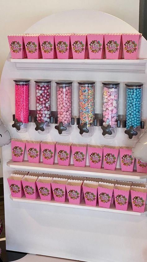 A pink LOL doll themed candy bar at a children's birthday.  Birthday party inspiration for a little girl Doll Themed Birthday Party, Diy Party Props, Party Rentals Business, Party Rental Ideas, Candy Wall, Candy Stand, Candy Display, Rental Ideas, Candy Cart