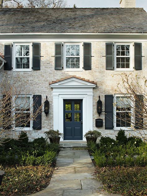 Adding shutters brings a historical and colorful touch to your home! More curb appeal ideas:  http://www.bhg.com/home-improvement/exteriors/curb-appeal/add-exterior-color/?socsrc=bhgpin100413shutterideas&page=6 Cara Brown Designs, Black Shutters, House Redo, White Wash Brick, Colonial Exterior, House Facade, Colonial Style Homes, Grey Exterior, Shutters Exterior