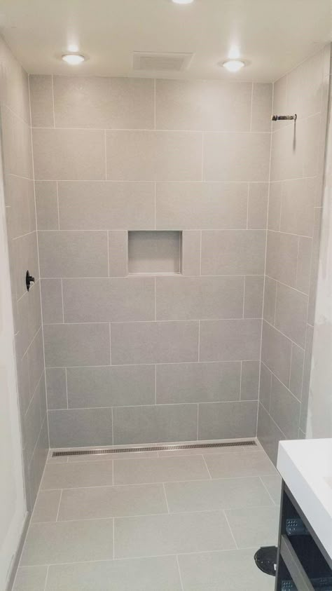 Shower Tile Same As Floor Tile, Large Tile For Shower Floor, Shower Remodel With Large Tile, Large White Tile Shower Ideas Wall, Large Horizontal Shower Tile, Light Shower Tile Ideas, Large Tile For Bathroom, Big White Tile Bathroom Walls, Wide Tile Bathroom