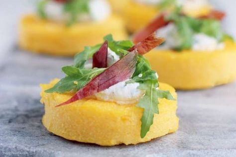 These gluten-free polenta crostini scream TASTY at every bite. All you need is a bunch of simple ingredients to put together this simple yet elegant starter. #glutenfree #italian #polenta thepetitecook.com New Years Eve Food, Uk Food, New Year's Food, Impressive Recipes, Gluten Free Snacks, Party Recipes, Best Chicken Recipes, British Food, Tasty Bites