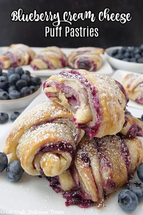 Blueberry Cream Cheese Puff Pastry is a flaky and delicious pastry recipe that is filled with a blueberry filling, a fluffy cream cheese mixture, and dusted with powdered sugar for added sweetness. Almond Puff Pastry Danish, Puff Pastry Dessert Designs, Cream Cheese Filled Scones, Blueberry Cream Cheese Pastry, Dessert With Pastry Sheets, Blueberry Crossiant, Blitz Puff Pastry Recipe, Puff Pastry Almond Paste Recipes, Cream And Berry Filled Pastry Balls