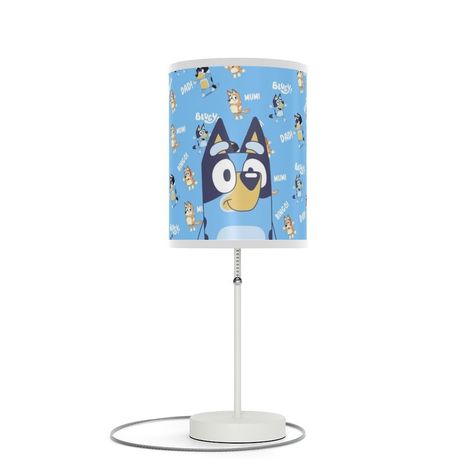 Decorate your kid's bedroom with Bluey lamp lights. This Bluey night light is perfect for families who love to watch Bluey cartoons. You can choose between the Bluey or Bingo version. Also, it's ideal as a birthday gift for kids. This unique table lamp stand features a steel base with a classy silver or white finish. NB! Please note that these lamps come with a power chord adaptor type supported only in the USA and Canada (Type A plug with 2x flat pins) - Not Suitable for EU plugs. One siz... Disney Bluey Bedroom Ideas, Bluey Merch, Unique Table Lamp, Power Chord, Kids Bedroom Inspiration, Unique Table Lamps, Lamp Stand, Steel Lamp, Nursery Room Inspiration