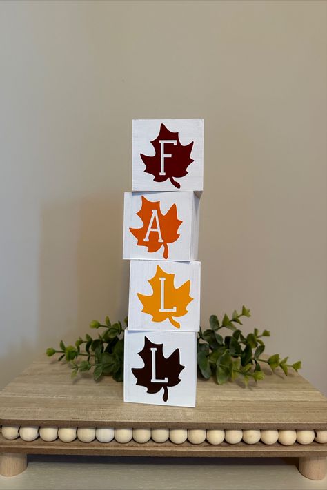 These decorative blocks are the perfect addition to your fall and Thanksgiving decor, bringing a warm and cozy feel to any room. The blocks feature beautiful fall leaf designs that will capture the essence of the season. They can be stacked together or displayed separately, allowing you to create your own unique arrangement. Not only do these blocks make a great addition to your own home, but they also make a thoughtful hostess gift for Thanksgiving celebrations. Wooden Ideas Handmade, Wood Thanksgiving Decor, Wood Block Fall Crafts, Diy Wood Blocks Decor, Fall Blocks Wood Crafts, 2 X 4 Crafts, Fall Craft Fair Ideas To Sell, Thanksgiving Blocks Diy, Thanksgiving Diy Decorations