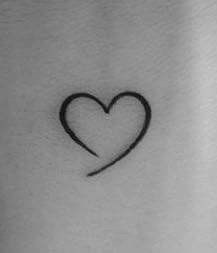 Heart Tattoo With Meaning, Heart Tattoo On Forearm, Black Heart Wrist Tattoo, Incomplete Heart Tattoo, Swirly Heart Tattoo, Small Heart Tattoo Placement, Small Love Heart Tattoo, Hart Tattoo Design, Minimalistic Heart Tattoo