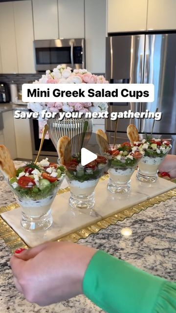 Reina G. Slim on Instagram: "Mini Greek Salad Cups 🥗 What you will need 👇🏻

Rather than the usual Greek Salad in a big bowl, why not layer in a clear cup when hosting? Not only they look so amazing and delicious but they sure will wow your family and friends when entertaining! Here’s what you will need: 👇🏻

Ingredients:
▫️Hummus (Classic ) @cedarsfoods 
▫️Tzatziki sauce @cedarsfoods 
▫️Kalamata olives (sliced)
▫️Marinated Artichokes (sliced) 
▫️Romaine lettuce (shredded) 
▫️Cucumbers ( diced)
▫️Cherry tomatoes (halved)
▫️Red onions (diced) 
▫️Feta cheese (crumbled)
▫️Fresh dill for garnish (optional) 
▫️Mini Naan dippers @stonefirenaan 

▫️Clear disposable cups ( I didn’t have any on hand that’s why I used glass)
▫️Mini appetizer forks

Follow along to see how I prepared these heavenl Salad Appetizers In A Cup, Greek Salad Cups, Salad Cups For Party, Naan Dippers, Mini Naan, Salad Presentation, Greek Salads, Salad Cups, Marinated Artichokes