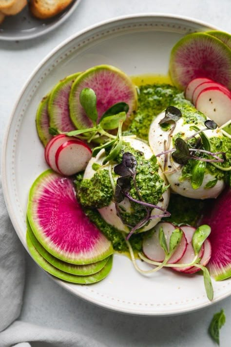 This Spring Burrata with Green Goddess Pesto is a perfect, fresh and light appetizer for spring! The burrata is perfectly creamy and amazing as always, and the green goddess pesto is bright, insanely flavorful, and filled with ALL the fresh herbs! The watermelon radishes and microgreens add another layer of spring produce and color. Can't get enough! #springproduce #appetizer #burrata #pesto #greengoddess Burrata Appetizer, Summer Plates, Burrata Recipe, Spring Appetizers, Spring Produce, Plats Healthy, Watermelon Radish, Light Appetizers, Bar Food